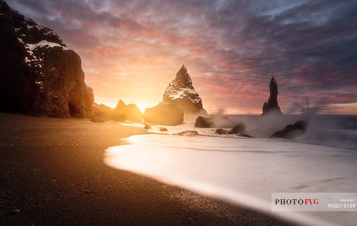 The black sand beach of Reynisfjara and the mount Reynisfjall from the Dyrholaey promontory in the southern coast of Iceland, Vik