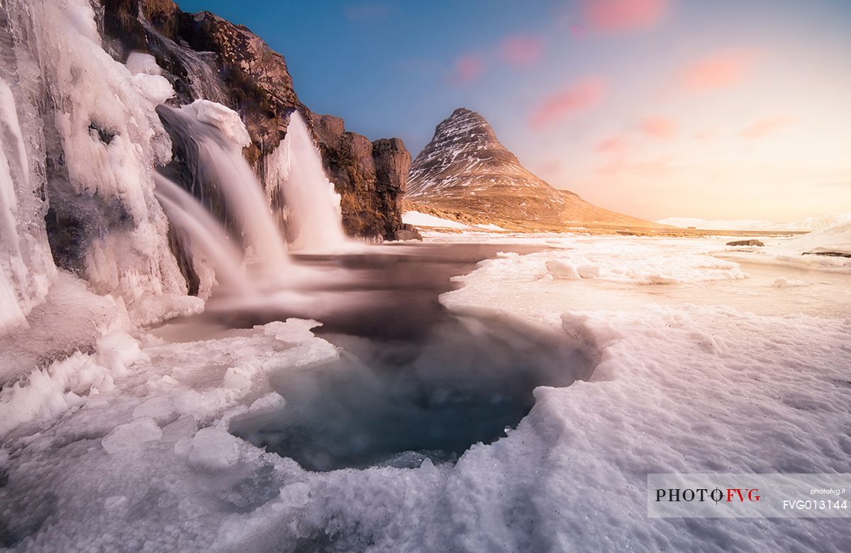 Kirkjufell mountain with water falls at winter, Iceland