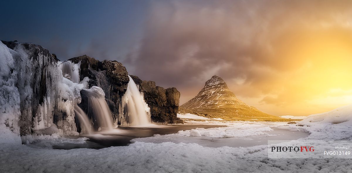 Kirkjufell mountain with water falls at winter, Iceland