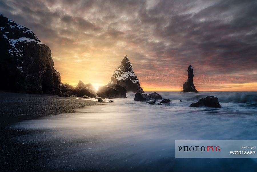 The black sand beach of Reynisfjara and the mount Reynisfjall from the Dyrholaey promontory in the southern coast of Iceland, Vik