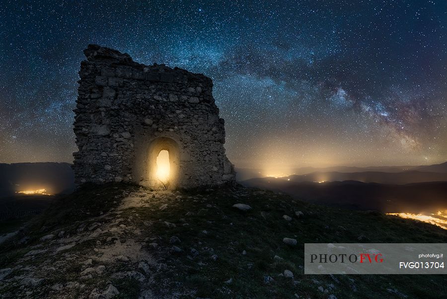 Milky way landscape over Calascio fortress, ancient village of Abruzzo, Rocca Calascio, Gran Sasso and Monti della Laga national park