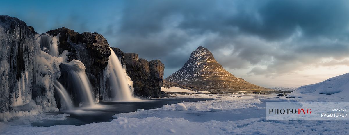 Kirkjufell mountain with water falls at winter, Iceland