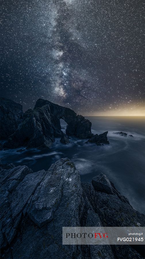 Iconic scottish landscape, sea arch whit milky way, Luskentyre, Harris isle, Hebrides, Scotland, UK