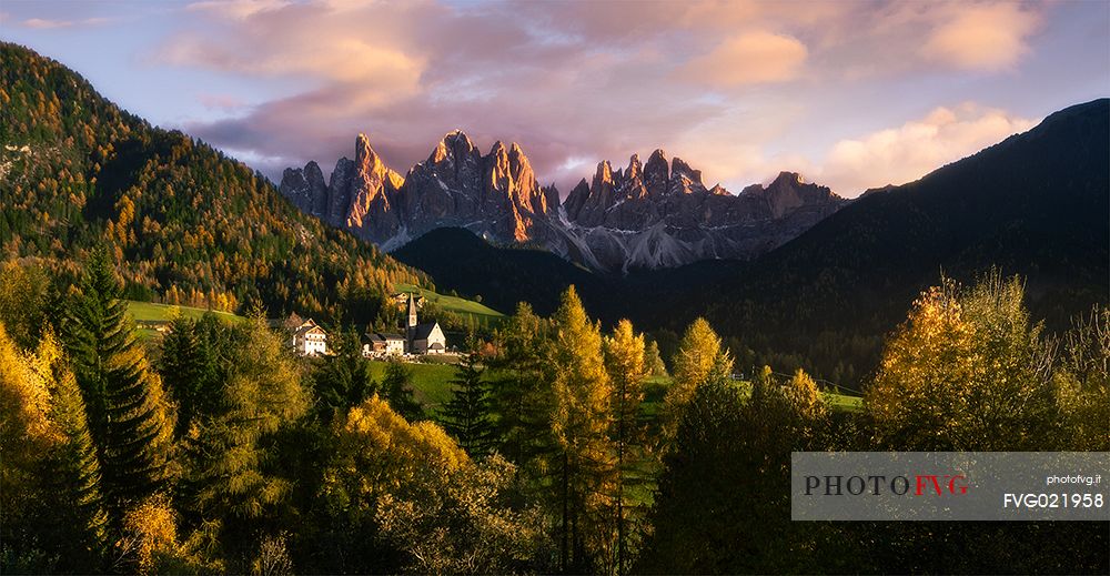 Fourteenth century church with Odle mountain range, Geisler Gruppe, Funes valley, dolomites, Italy