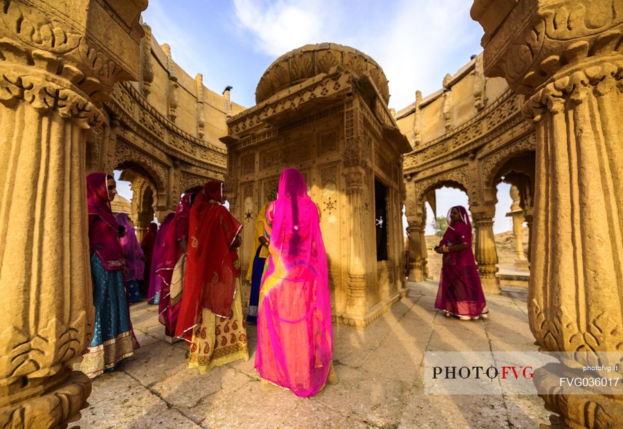 Ceremony in the temple in desert, women dress the typical sari, Jaisalmer, Rajasthan, India