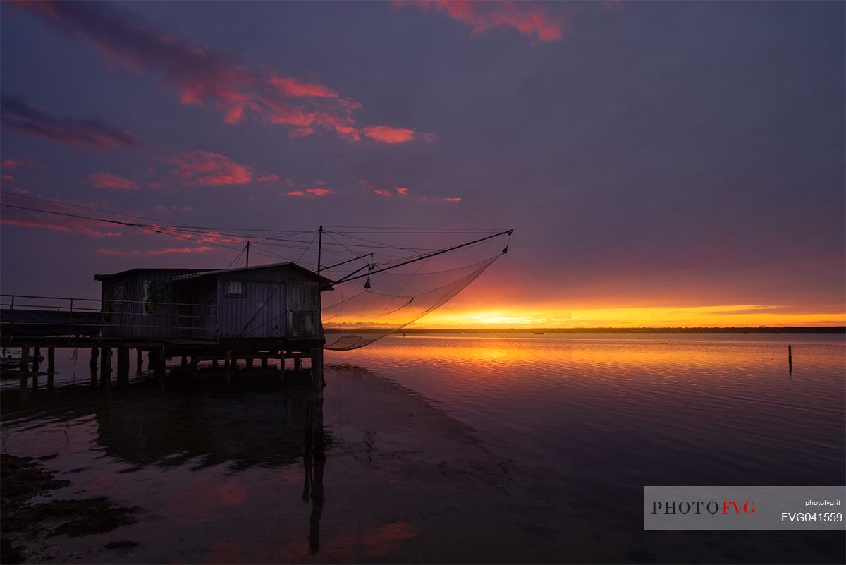 Typical fishing house in the adriatic coast at sunset, Marina di Ravenna, Emilia Romagna, Italy, Europe