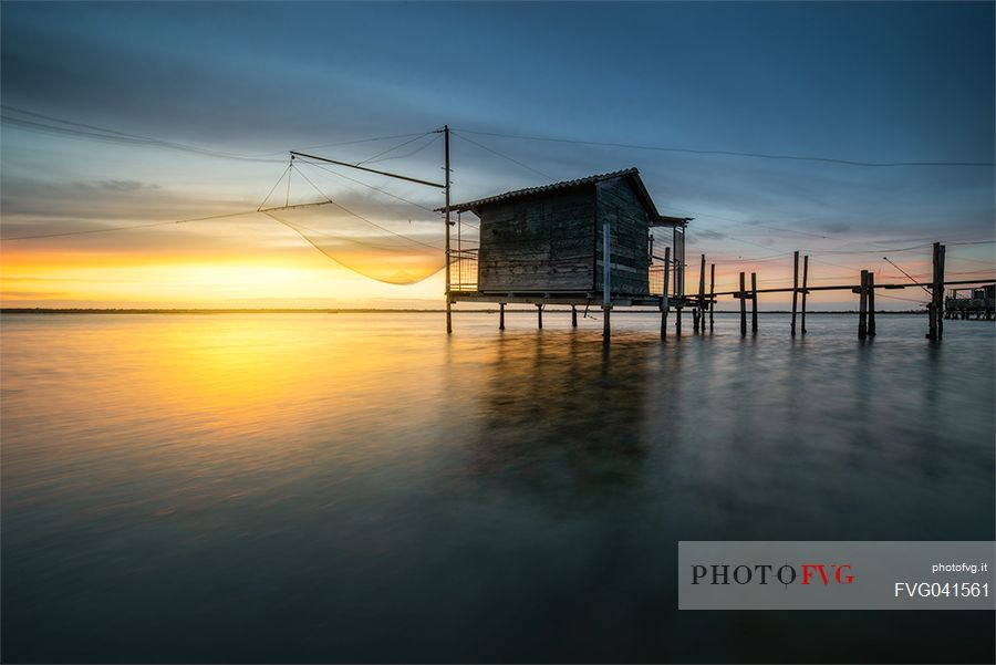 Typical fishing house in the adriatic coast at sunset, Marina di Ravenna, Emilia Romagna, Italy, Europe