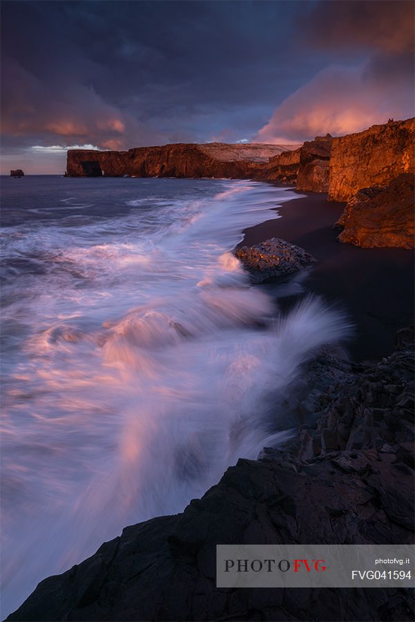 Sunrise from lava beach of Cape Dyrholaey near Vik i Myrdal, Iceland, Europe