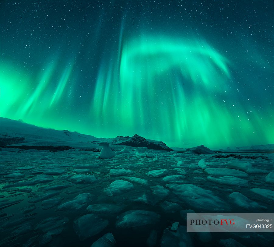 Northern lights above Jokulsarlon glacial lake at Vatnajokull glacier, Iceland, Europe