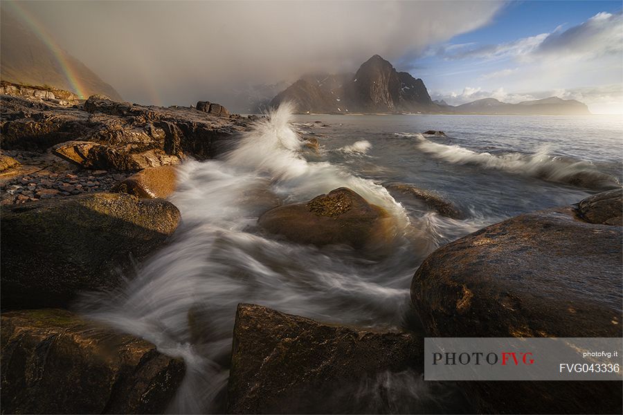 Vareid bay and the rainbow, Flakstadoya, Lofoten Islands, Scandinavia, Norway, Europe