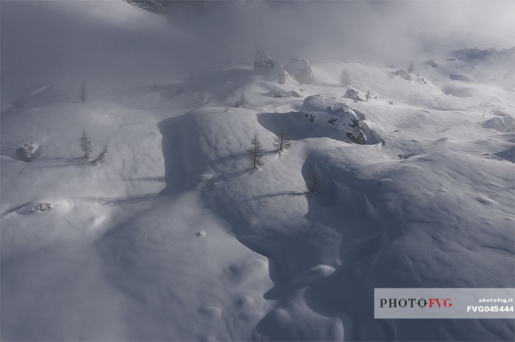 Aerial view of the wild landscape in the snow storm, Cortina d'Ampezzo, Dolomites, Italy, Europe