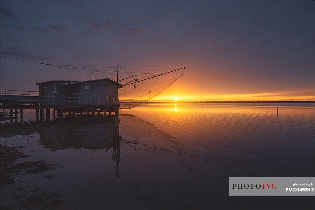 Typical fishing house in the adriatic coast at sunset, Marina di Ravenna, Emilia Romagna, Italy, Europe