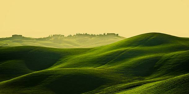 sunrise over the Crete Senesi in a misty morning