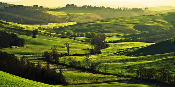 sunrise over the Crete Senesi in a misty morning