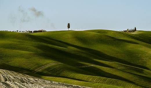 sunrise over the Crete Senesi in a misty morning