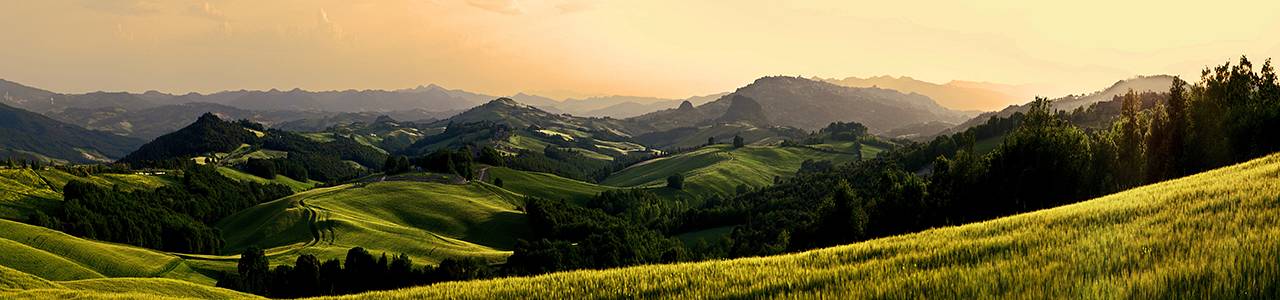 sunrise over the Crete Senesi in a misty morning