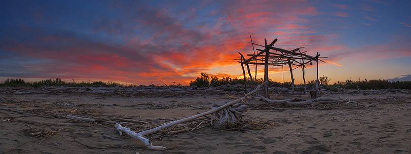 beach panorama whit hand made hut on sunset