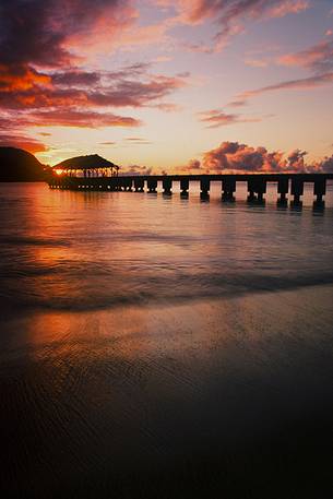 pier on kauai island at sunset