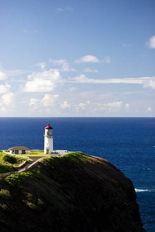 lighthouse on kauai island at sunset