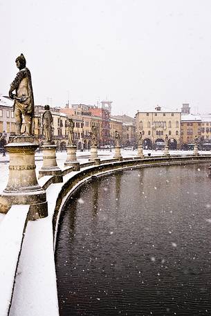 View of Prato della Valle place, under a winter snowfall