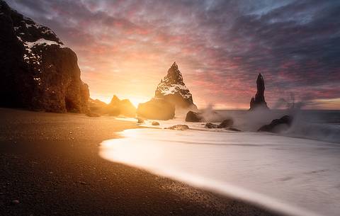 The black sand beach of Reynisfjara and the mount Reynisfjall from the Dyrholaey promontory in the southern coast of Iceland, Vik The black sand beach of Reynisfjara and the mount Reynisfjall from the Dyrholaey promontory in the southern coast of Iceland, Vik