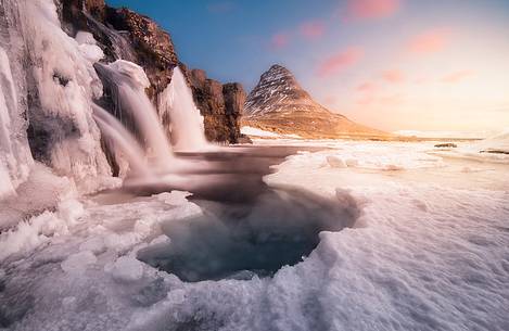 Kirkjufell mountain with water falls at winter, Iceland