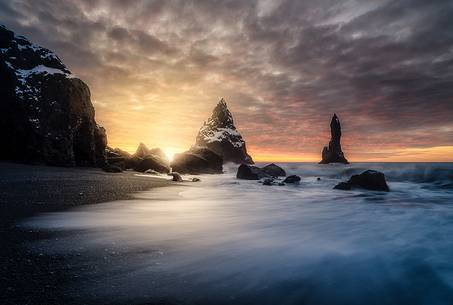 The black sand beach of Reynisfjara and the mount Reynisfjall from the Dyrholaey promontory in the southern coast of Iceland, Vik