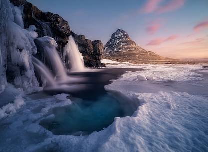 Kirkjufell mountain with water falls at winter, Iceland