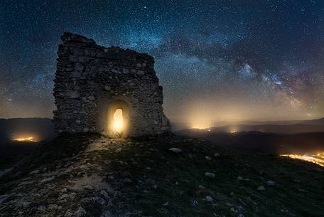 Milky way landscape over Calascio fortress, ancient village of Abruzzo, Rocca Calascio, Gran Sasso and Monti della Laga national park