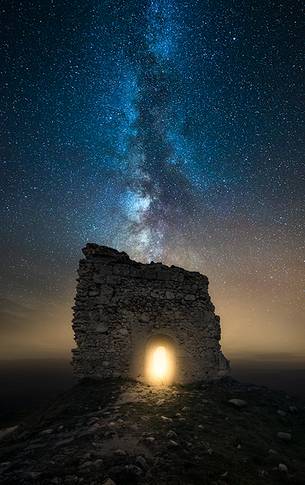 Milky way landscape over Calascio fortress, ancient village of Abruzzo, Gran Sasso and Monti della Laga national park