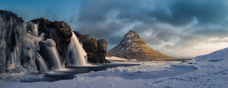 Kirkjufell mountain with water falls at winter, Iceland