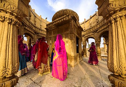 Ceremony in the temple in desert, women dress the typical sari, Jaisalmer, Rajasthan, India