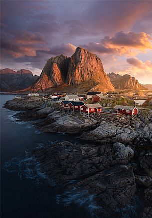 Hamny, village made up of traditional red wooden Rorbu houses near the fishing village of Reine, Moskenes Island, Lofoten Islands, Norway, Europe