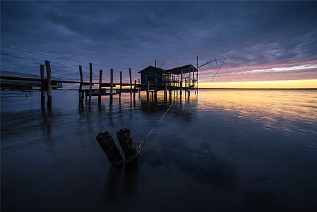 Typical fishing house in the adriatic coast at sunset, Marina di Ravenna, Emilia Romagna, Italy, Europe