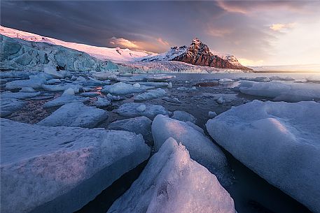 Unusual view of Jokulsarlon Lagoon and Vatnajokull  glacier at sunrise,  Iceland, Europe