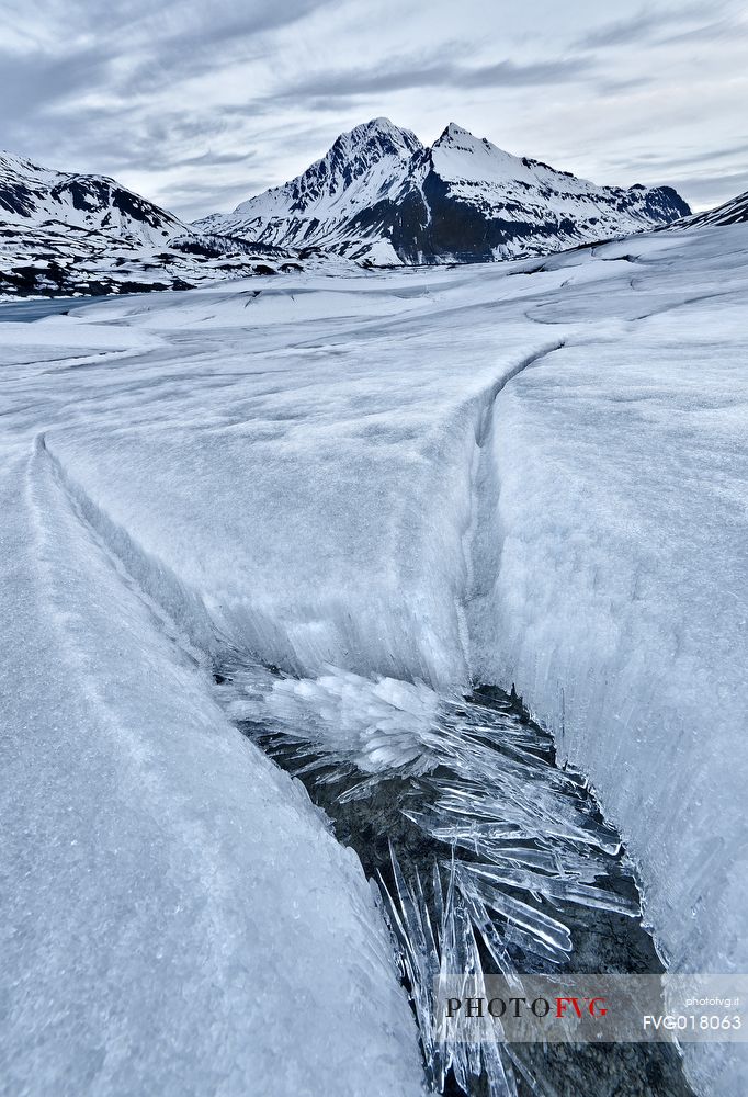 Ice formations in melting on the bottom of the lake of Mont Cenis dam