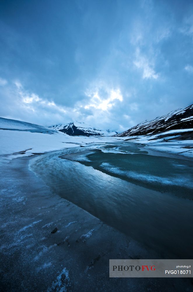 Ice formations in melting on the bottom of the lake of Mont Cenis dam