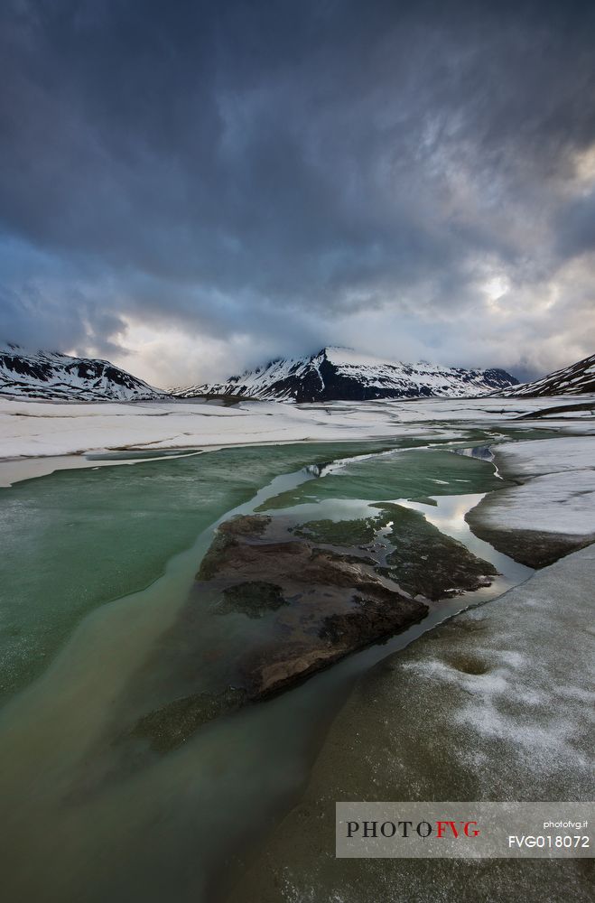 Ice formations in melting on the bottom of the lake of Mont Cenis dam