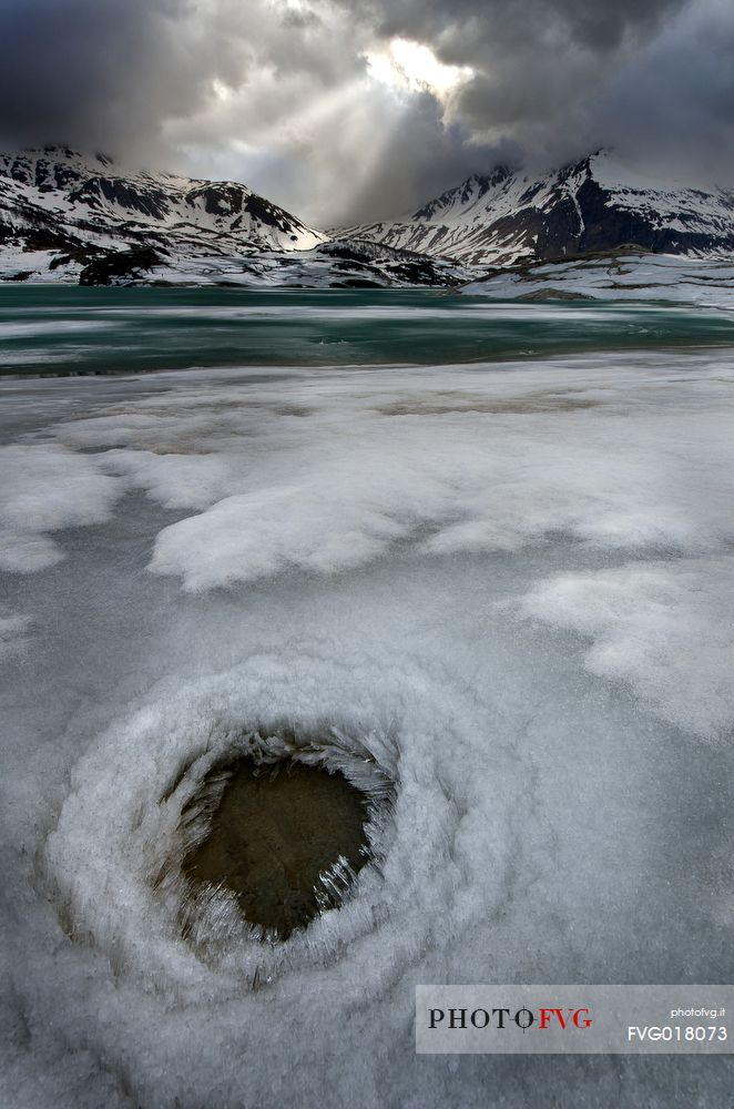 Ice formations in melting on the bottom of the lake of Mont Cenis dam