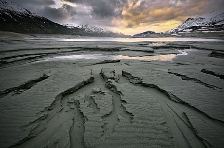 The bottom of the Mont Cenis dam during the sunset