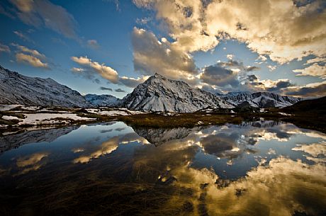 The last snow on the Roche d'Etache reflected on the little lake