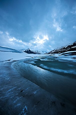 Ice formations in melting on the bottom of the lake of Mont Cenis dam