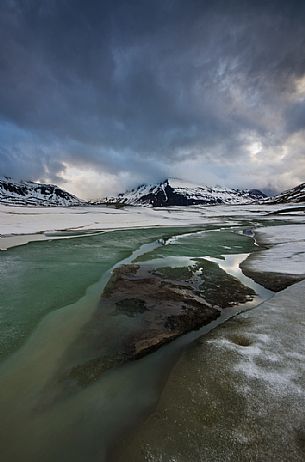 Ice formations in melting on the bottom of the lake of Mont Cenis dam