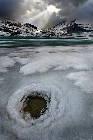 Ice formations in melting on the bottom of the lake of Mont Cenis dam