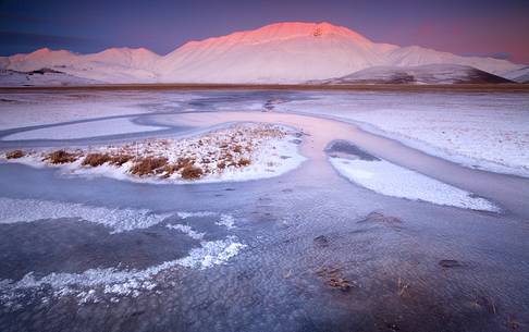 Fantastic sunset at -18  on the plain of Castelluccio di Norcia in the middle of winter.