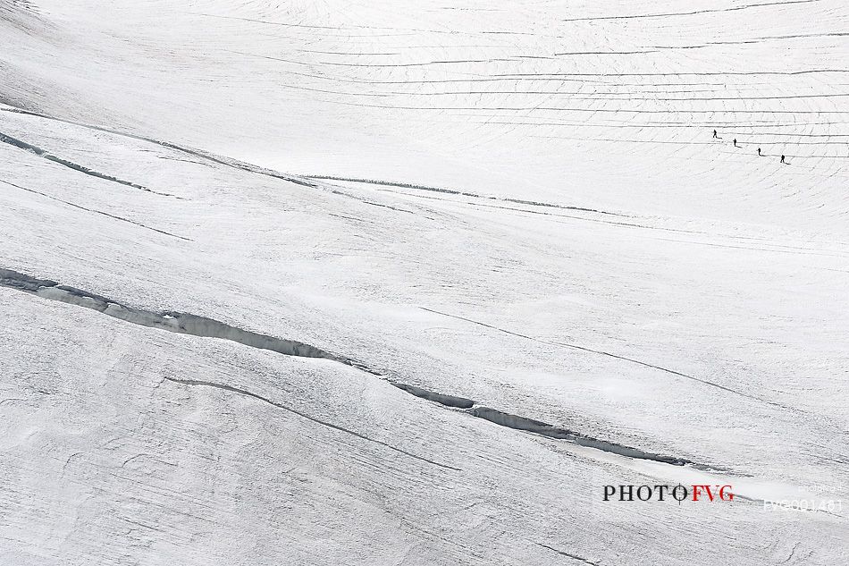 Alpinists on Aletsch glacier, view from Jungfraujoch, the highest railway station in the Alps, Berner Oberland, Switzerland, Europe