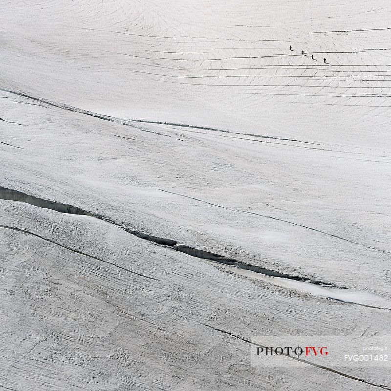 Alpinists on Aletsch glacier, view from Jungfraujoch, the highest railway station in the Alps, Berner Oberland, Switzerland, Europe