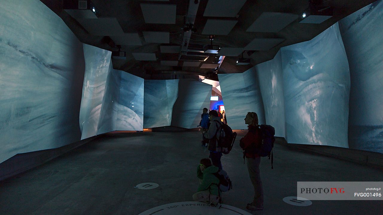 Tourist visiting the museum on the top of Jungfraujoch, the highest railway station in the Alps, Aletsch glacier, Bernese alps, Switzerland, Europe