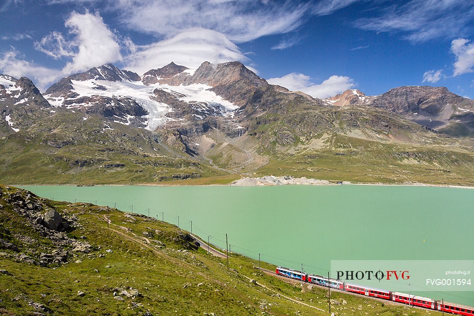 Rhaetian railway, Route from St. Moritz - Tirano, UNESCO World Heritage Site, at Bernina pass with Lago Bianco Lake, Engadin, Canton of Grisons, Switzerland, Europe