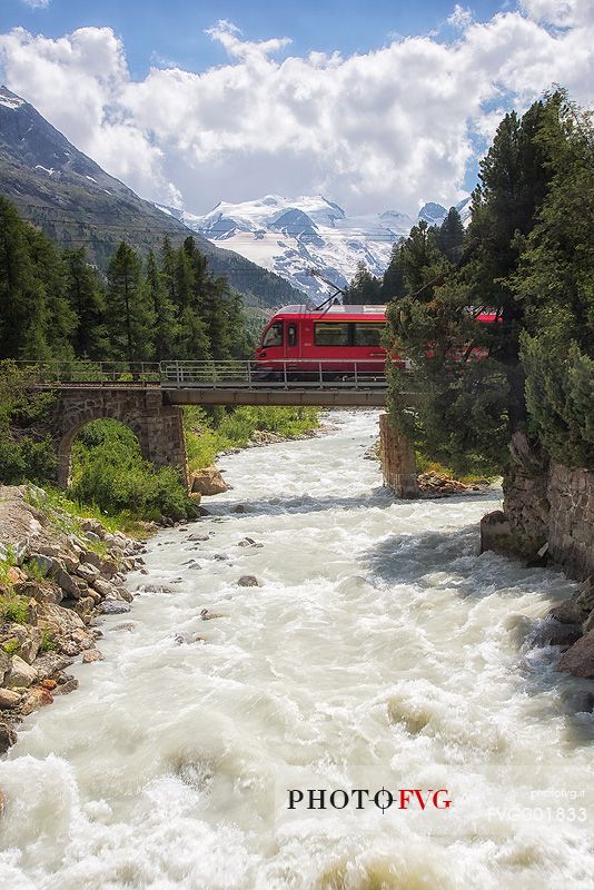 Rhaetian Railway above Ova da Morteratsch River in Val Morteratsch Valley near Pontresina, Engadin, Switzerland, Europe